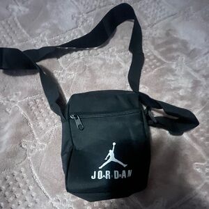 A black new jordan bag for putting stuff inside